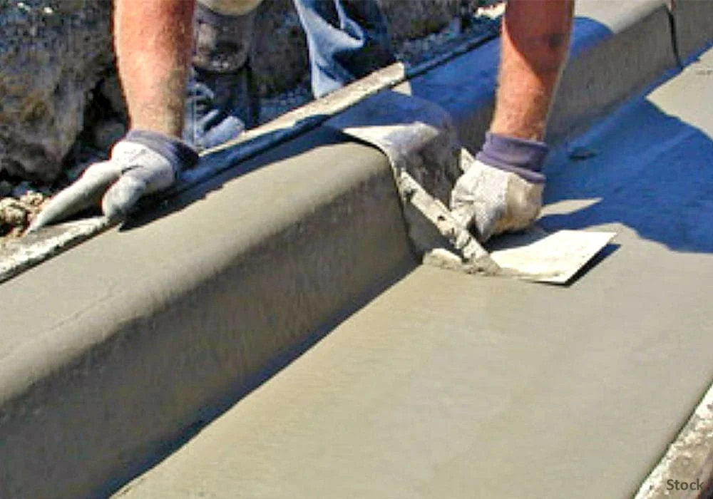 man-troweling-curb-and-gutter-installation-1