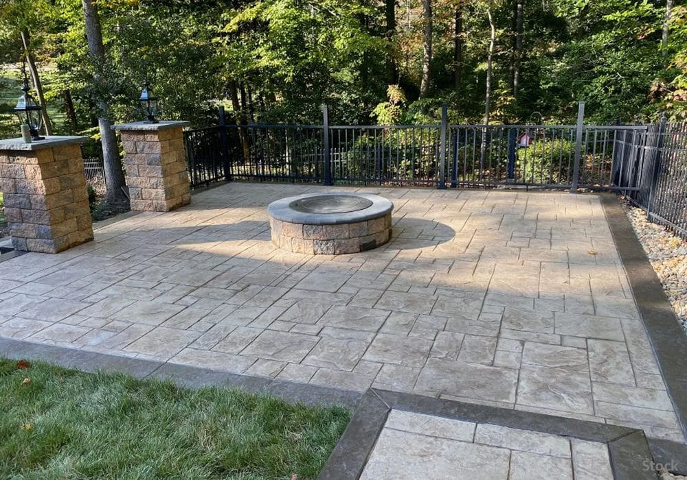 stamped-concrete-back-patio-with-firepit-and-brick-pillars-1